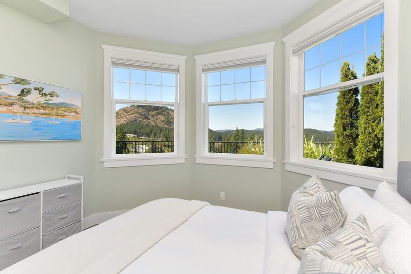 Lower floor sixth bedroom with queen bed.