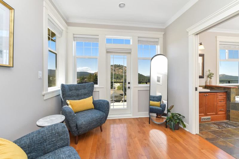 Primary bedroom seating and deck access.