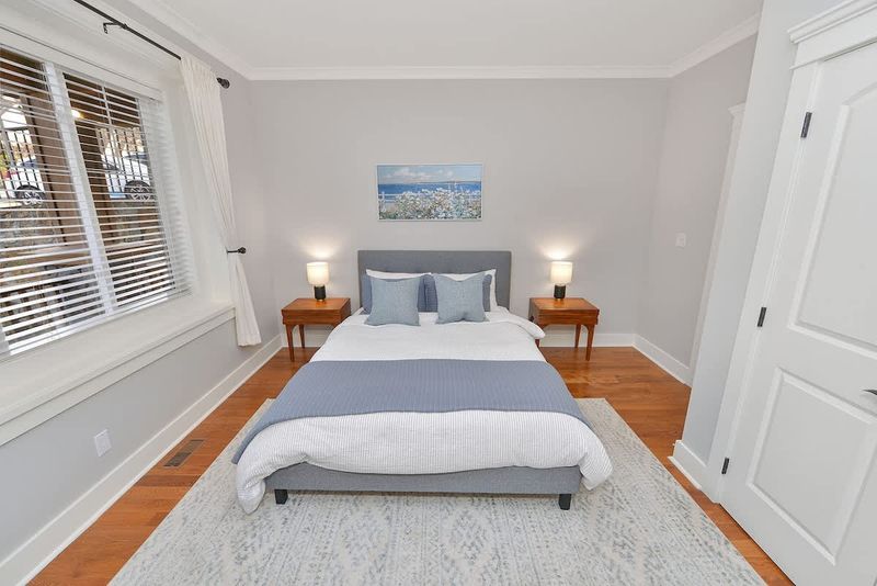 Main floor second bedroom. with queen bed.