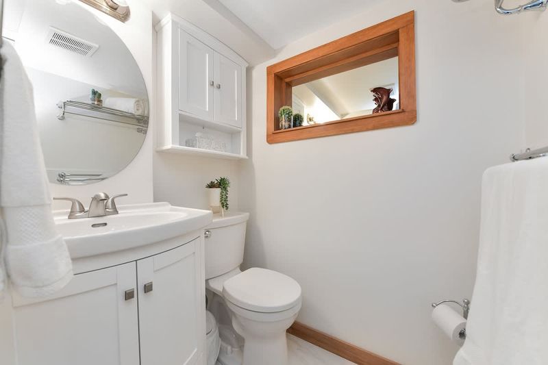 Bathroom with walk-in shower.