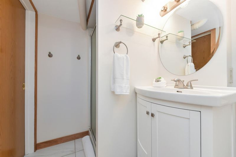 Bathroom with walk-in shower.