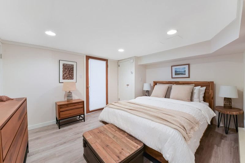 Den that acts as a second bedroom with queen bed.