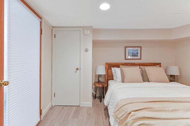 Den that acts as a second bedroom with queen bed.