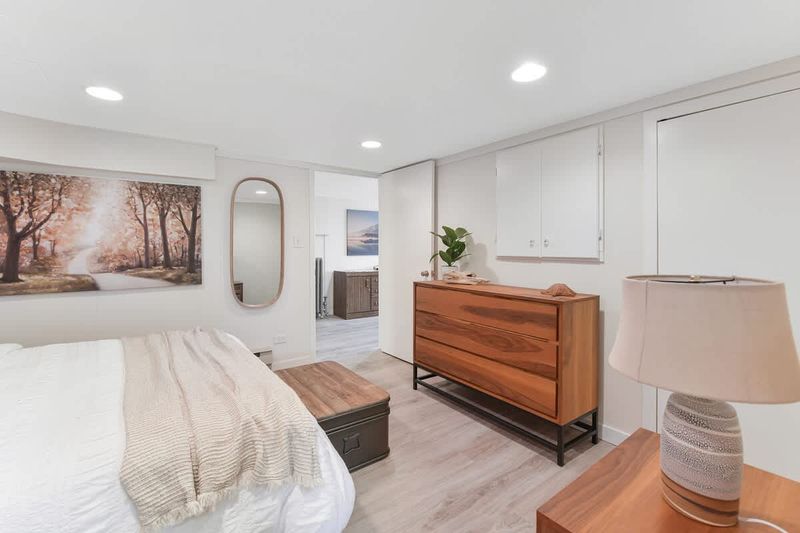 Den that acts as a second bedroom with queen bed.