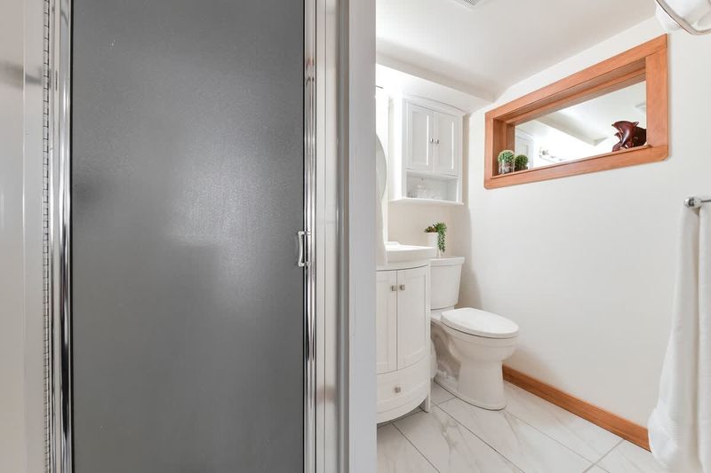 Bathroom with walk-in shower.