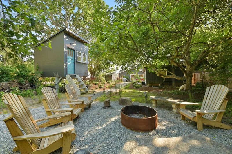 Backyard living and garden spaces. Please note that there is open burning bans seasonally thus the firepit use may not be available.