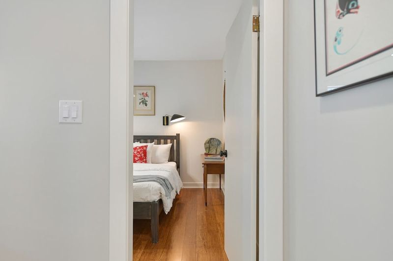 Second bedroom in the main cottage with two double beds.