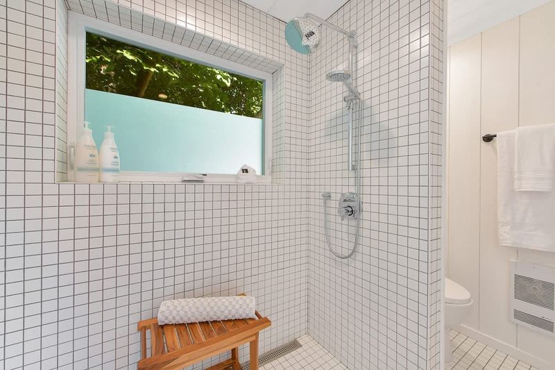 Second private bedroom cottage with king bed has private bathroom with walk in shower.