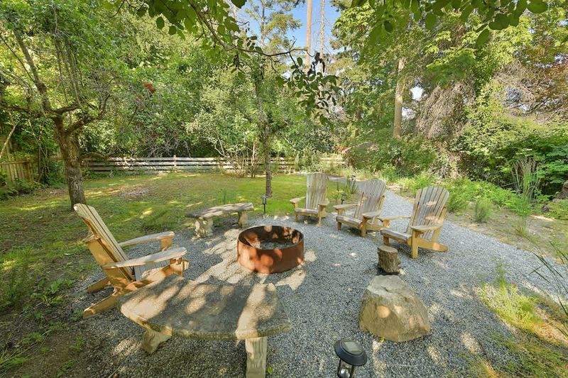 Backyard living and garden spaces. Please note that there is open burning bans seasonally thus the firepit use may not be available.