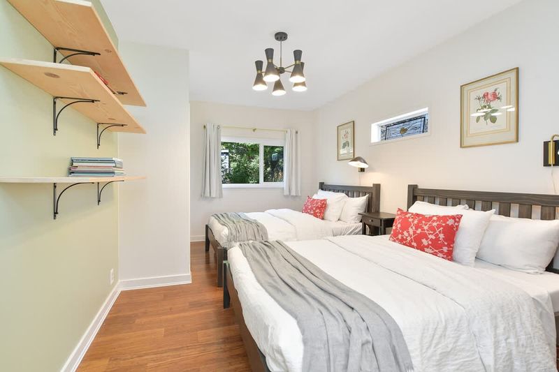 Second bedroom in the main cottage with two double beds.