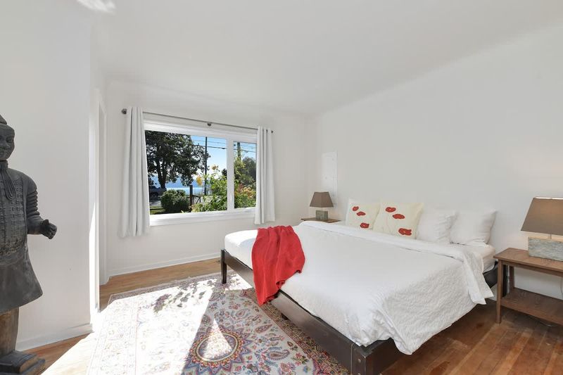 Primary bedroom in the main cottage with king bed.