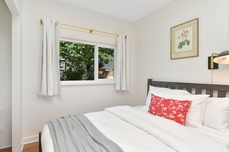Second bedroom in the main cottage with two double beds.