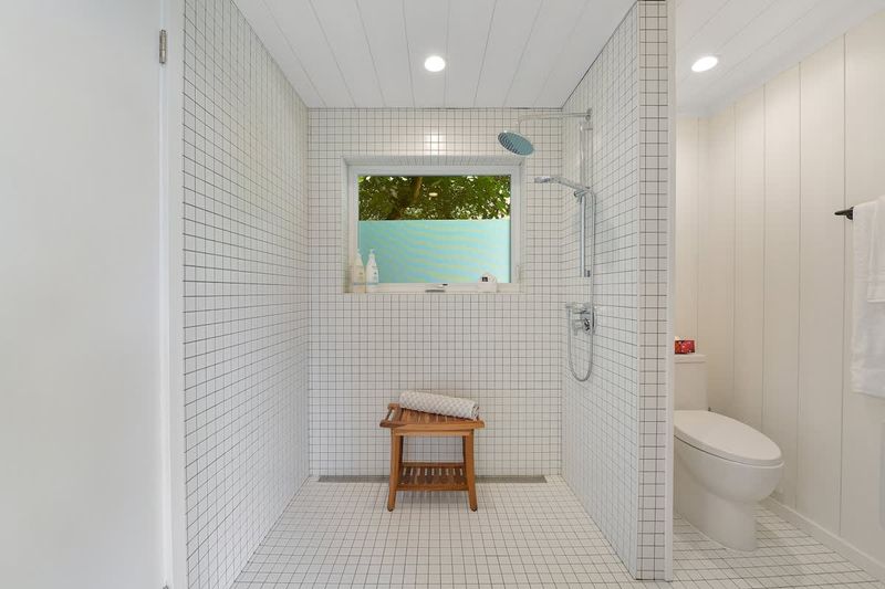 Second private bedroom cottage with king bed has private bathroom with walk in shower.