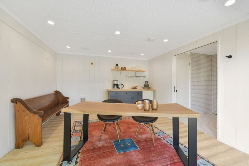 Second private bedroom cottage with king bed and breakfast bar plus coffee and tea bar.