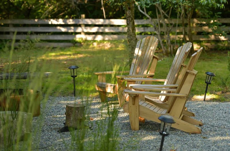 Backyard living and garden spaces. Please note that there is open burning bans seasonally thus the firepit use may not be available.