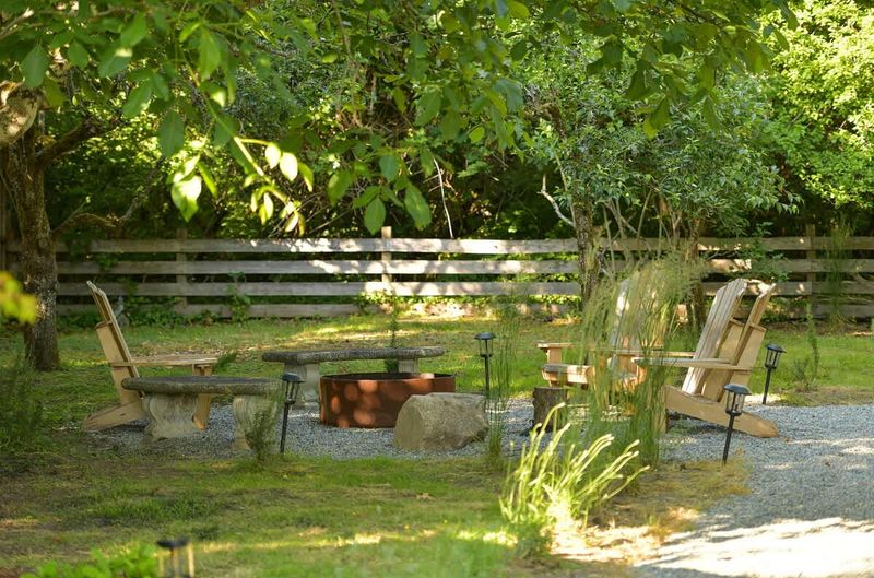 Backyard living and garden spaces. Please note that there is open burning bans seasonally thus the firepit use may not be available.