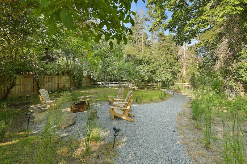 Backyard living and garden spaces. Please note that there is open burning bans seasonally thus the firepit use may not be available.