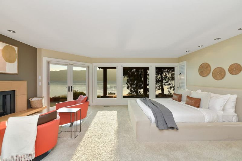 Immaculate primary bedroom with sweeping views and incredible ensuite.