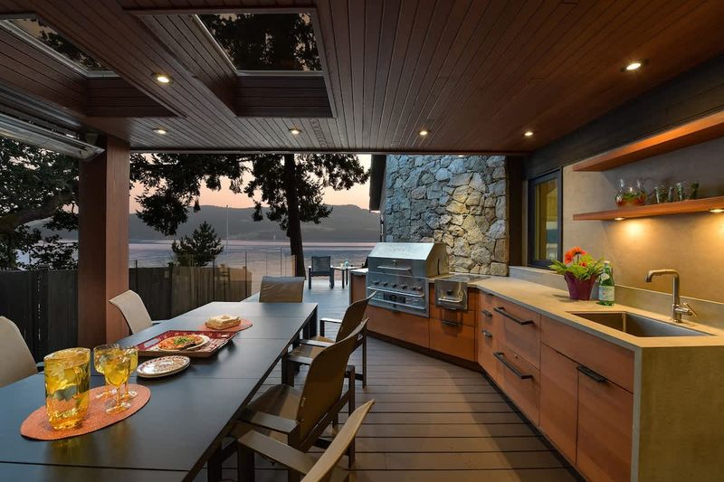 Outdoor deck dining space which is fully covered and can be used year round.