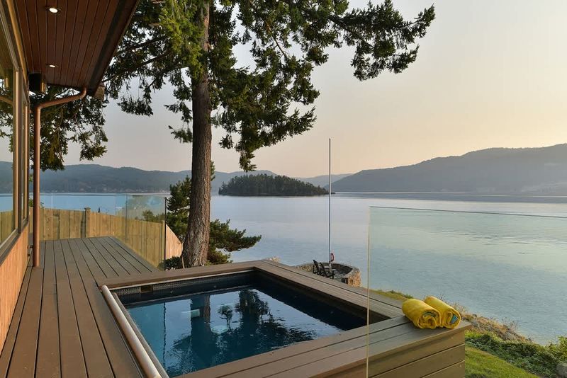Incredible outdoor living spaces on the oceanside of the main house plus hot tub!