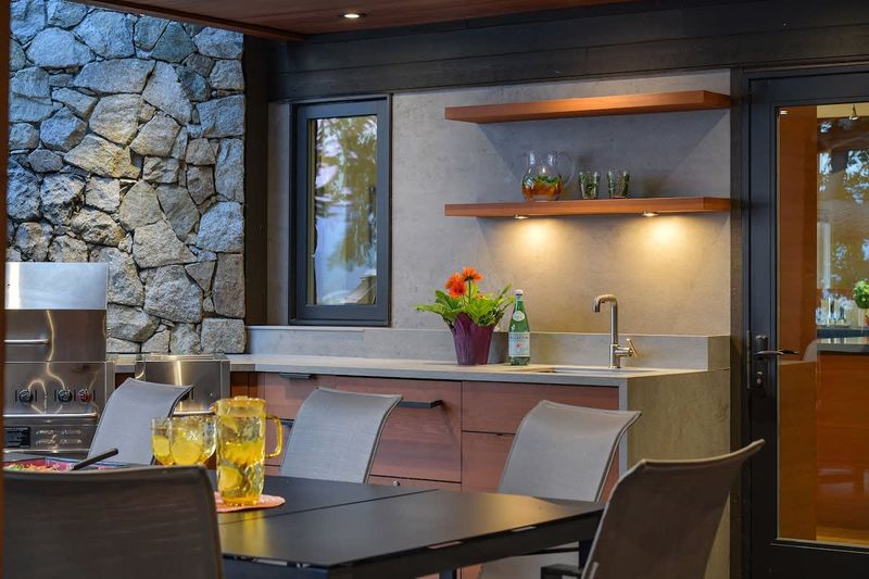 Outdoor deck dining space which is fully covered and can be used year round.