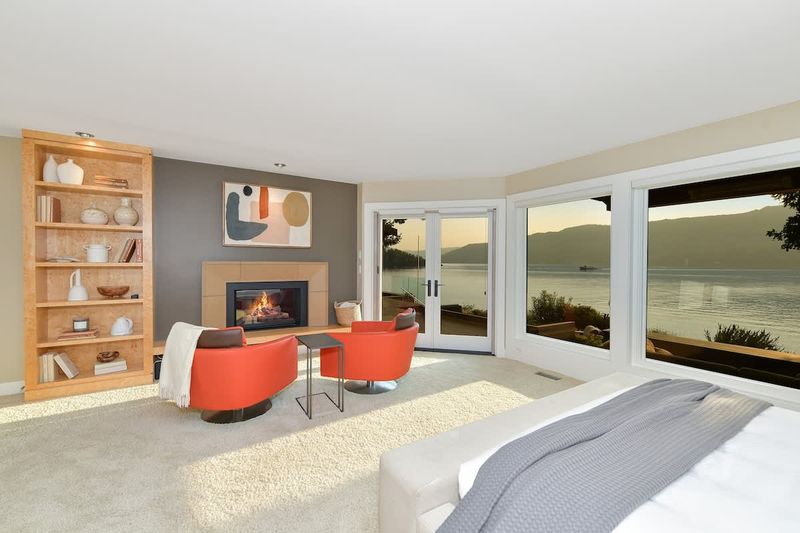 Immaculate primary bedroom with sweeping views and incredible ensuite.