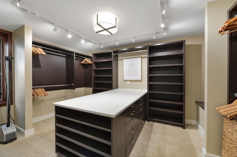 Immaculate primary bedroom with sweeping views and incredible ensuite.