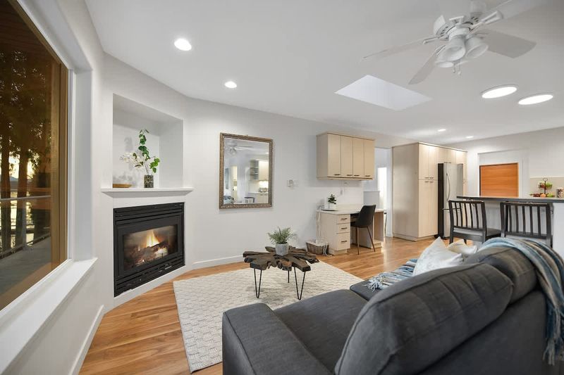 Main level addition living space near kitchen and dining room.