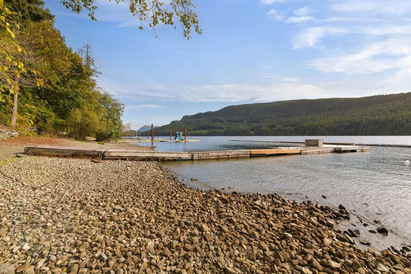 Lakeside beach and private dock.