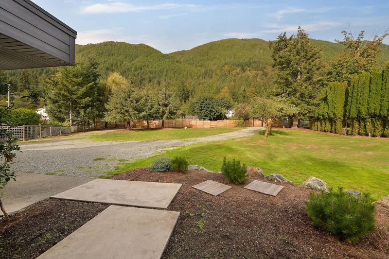 Parking area and main house entrance plus massive front yard.