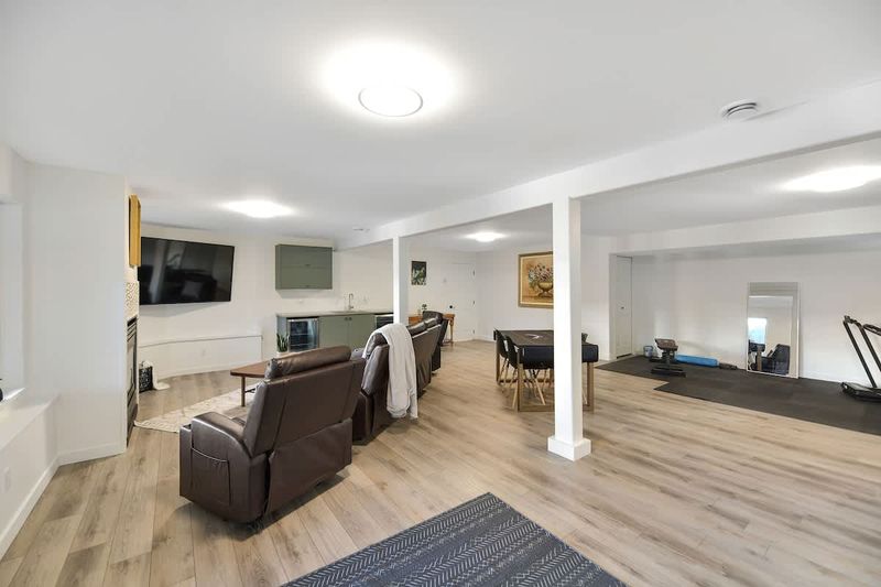 Ground level full rec-family room with workout space.