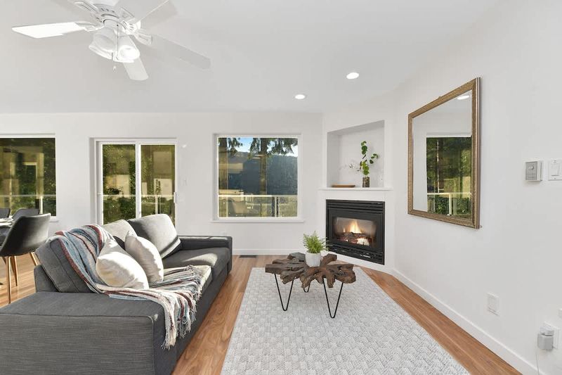 Main level addition living space near kitchen and dining room.