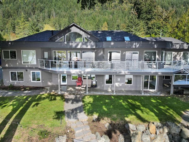 Lakeside view of the back of the house.