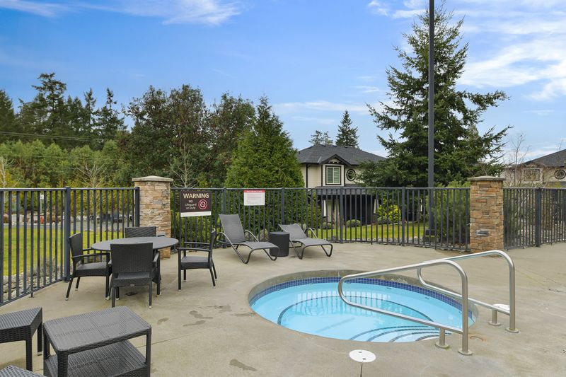Common area hot tub and seating area.