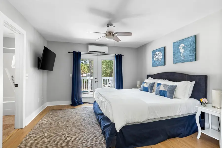 Bedroom 1: King Bed + Ceiling Fan & TV