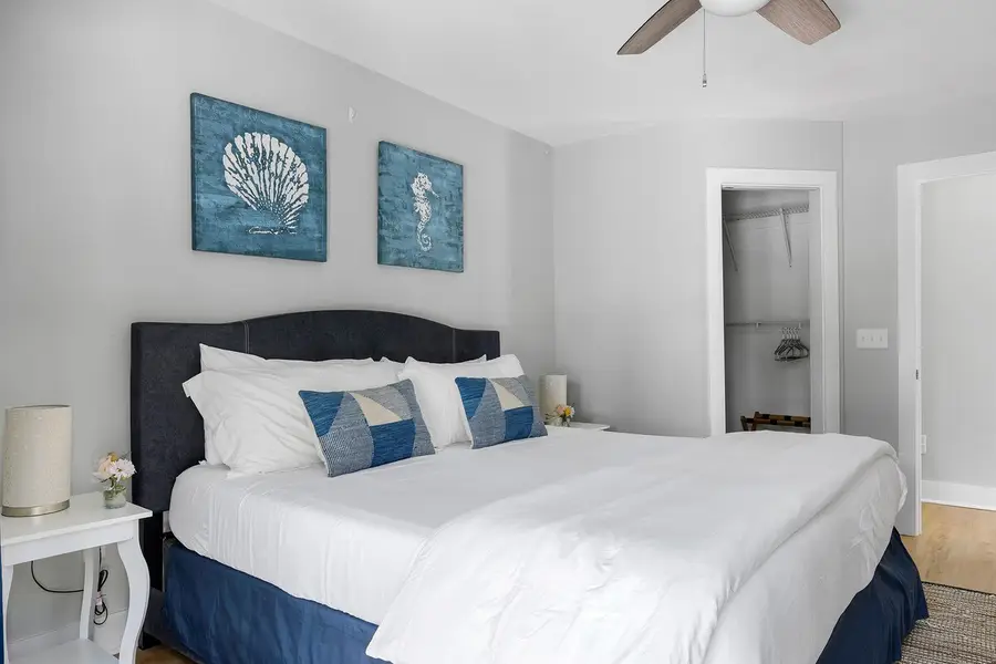 Bedroom 1: King Bed + Ceiling Fan & TV