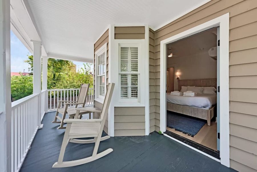 Catch a breath of fresh air on the charming front porch.