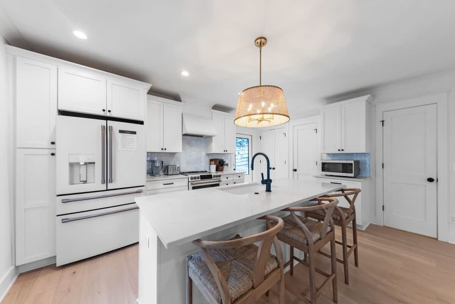 Have a few drinks at the kitchen island while watching the designated chef in action.