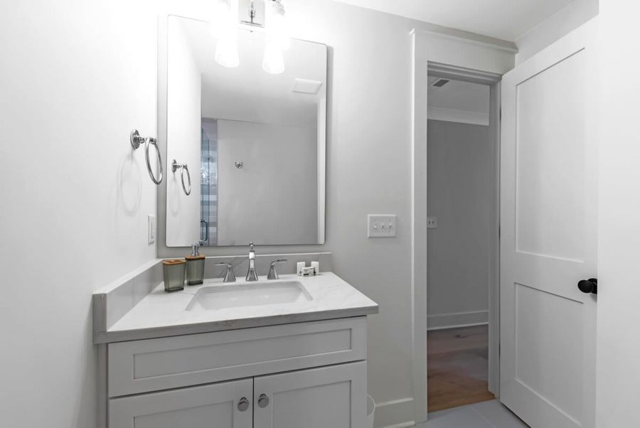 Step in front of the mirror and take one final look at your evening attire before going out.