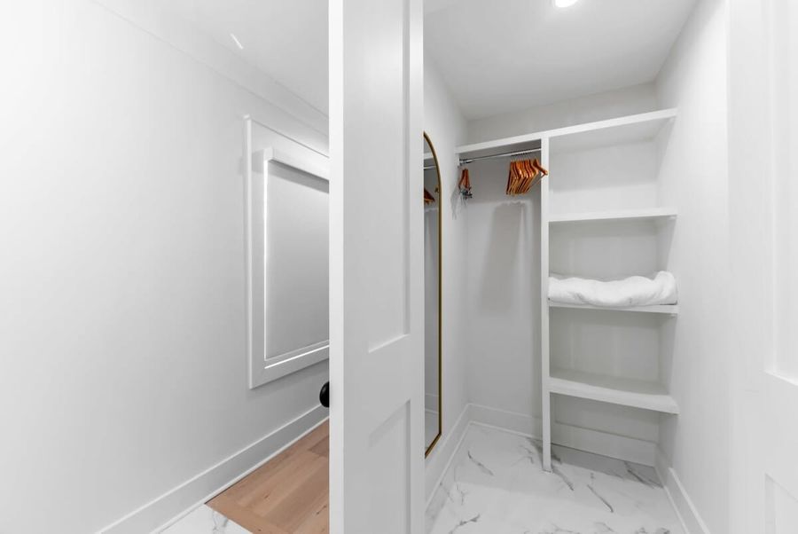 Keep your clothes clean and wrinkle-free in the spacious closet with hangers and shelves
