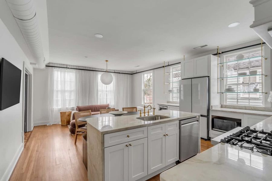 View of kitchen island and living room
