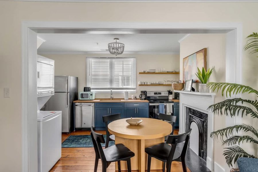 Gather around the dining table for 4, conveniently located beside the kitchen.