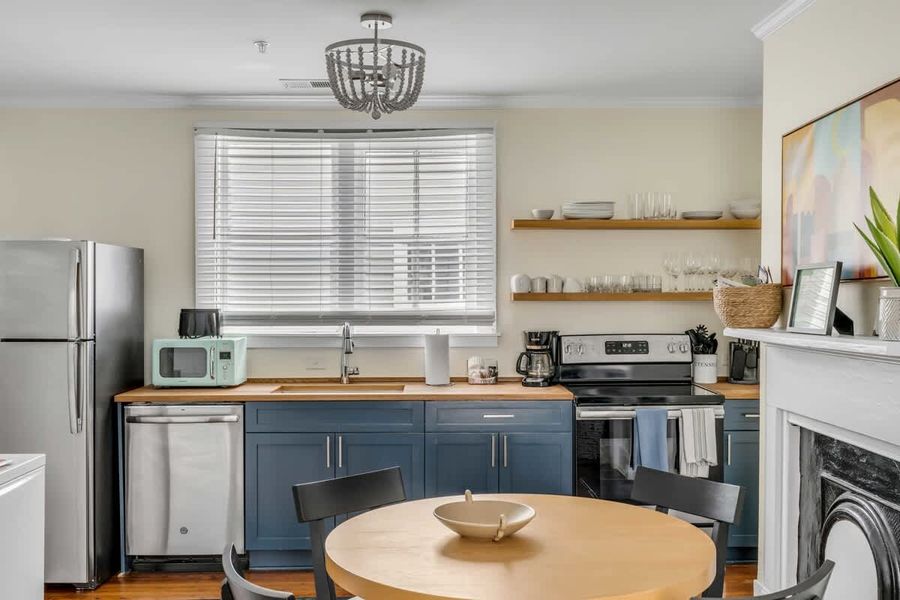 A well-appointed kitchen paired with a comfortable dining space for 4 guests.