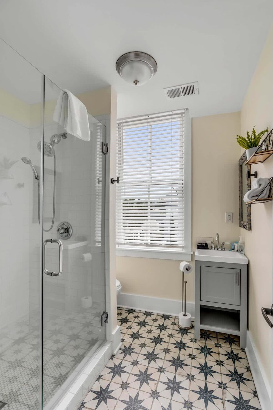 Bathroom 1: Refresh and unwind in the spacious bathroom with walk-in shower.