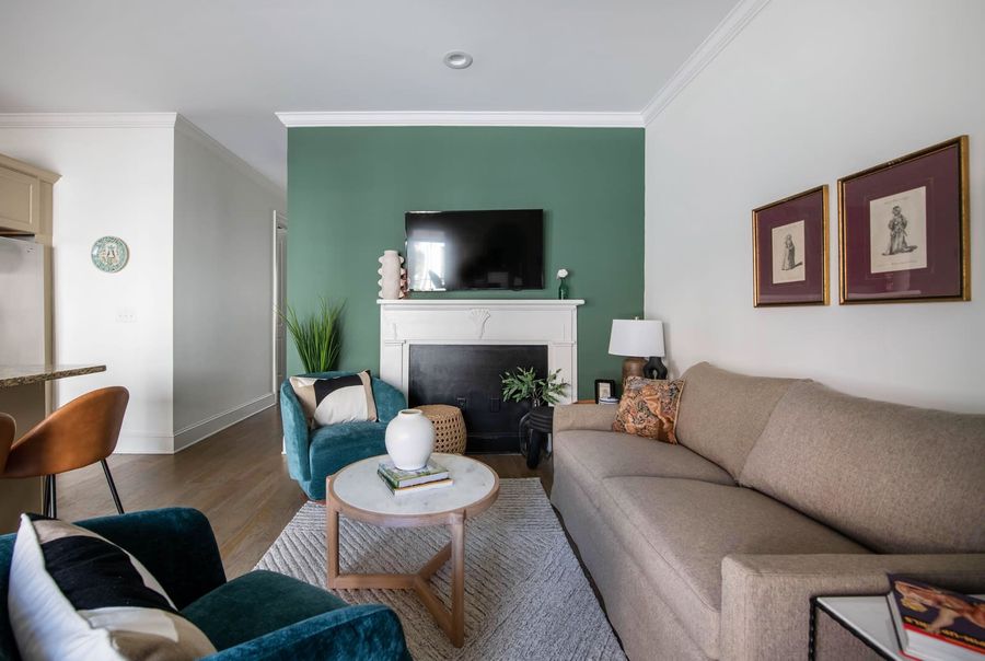 Living room space with a TV and pullout sofa 
