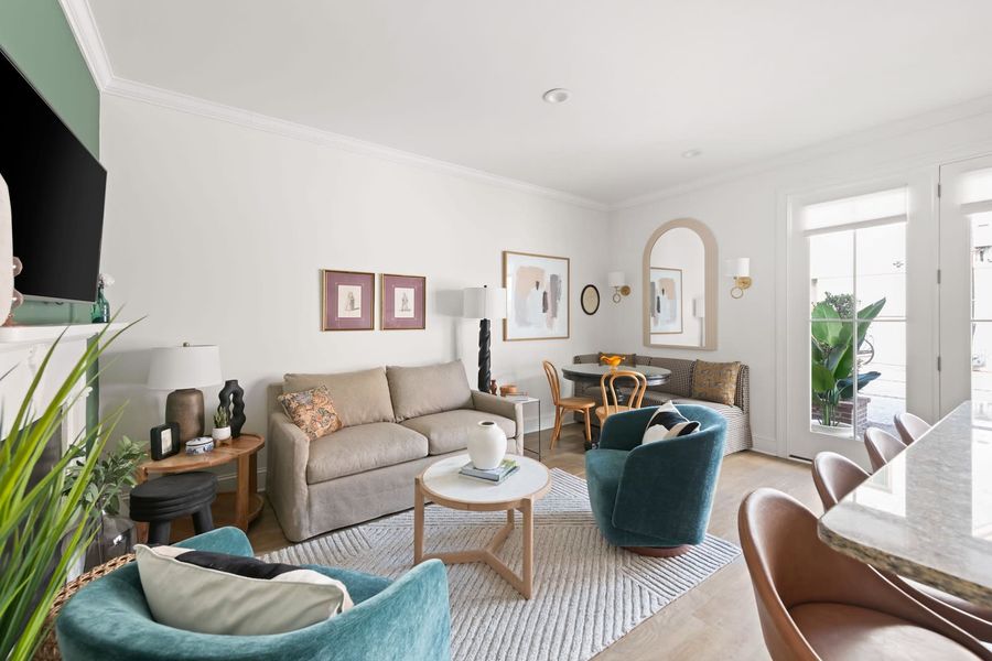 Living room space with a TV and pullout sofa 