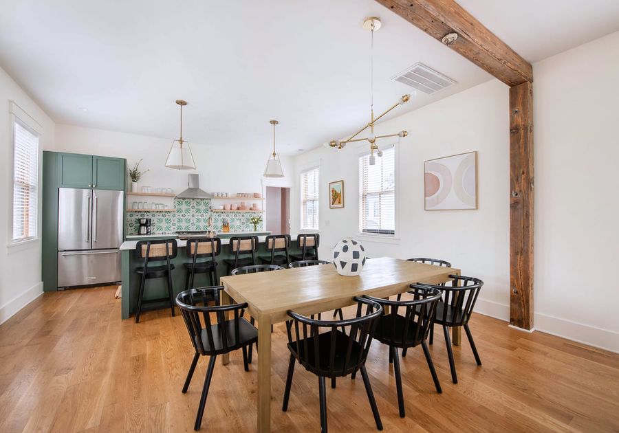 Spacious dining room with seating for 8 andd additional 5 seats at the island