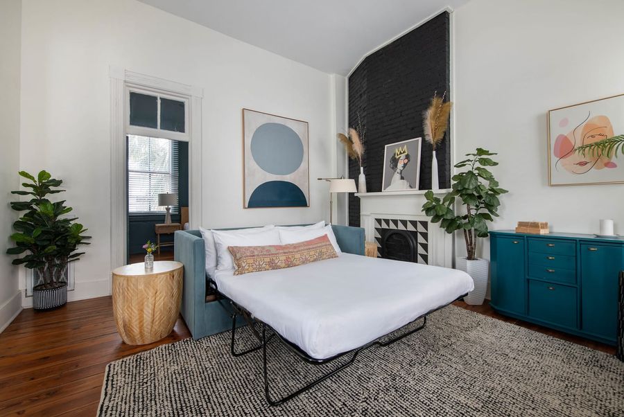 Living room space with sofa bed in Unit B