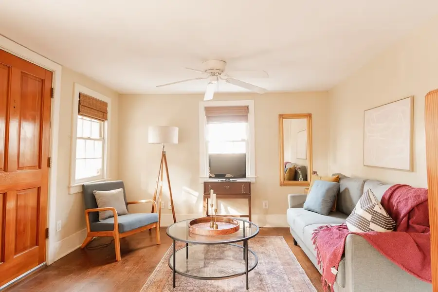 Beautiful natural light throughout the living room with a futon 