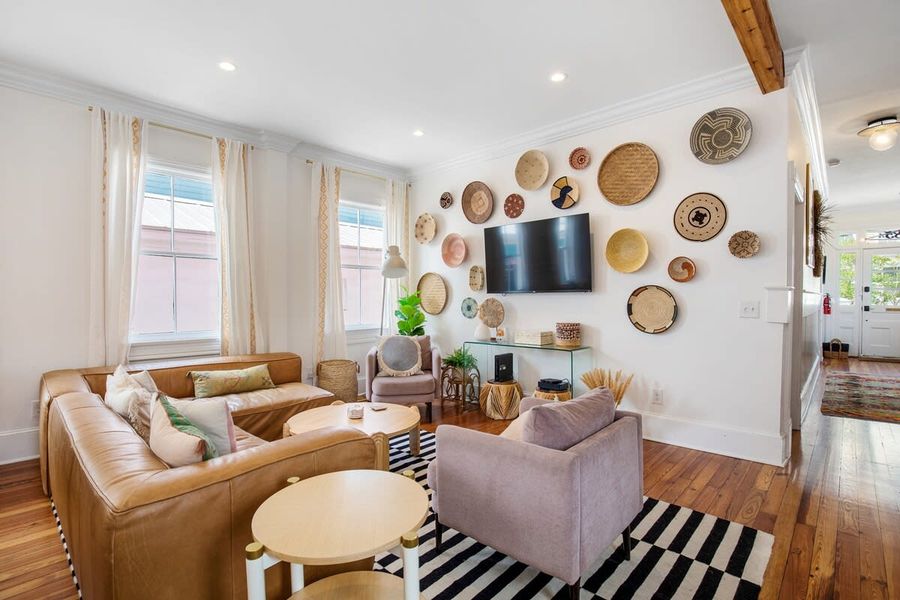 Spacious, pristine living room with cable TV and a smart TV
